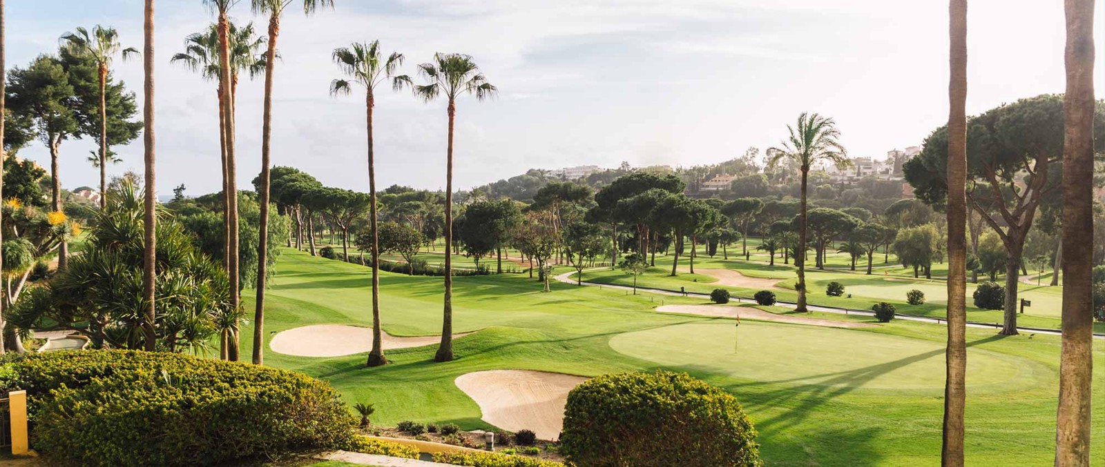 Río Real Golf course with water features and the Mediterranean coastline in the distance